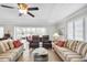 Comfortable living room with tile floors, ceiling fan, and an open view into the sunroom at 4000 Bal Harbor Blvd # 217, Punta Gorda, FL 33950