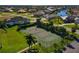 Aerial view of the tennis court and surrounding community at 4000 Bal Harbor Blvd # 217, Punta Gorda, FL 33950