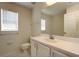 Bright bathroom with white cabinets and a large mirror at 4237 Irdell Ter, North Port, FL 34288