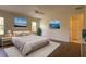Bedroom staged with a bed, area rug, and pictures creating a cozy and inviting atmosphere at 4237 Irdell Ter, North Port, FL 34288