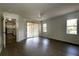 Bright bedroom with wood-look floors and sliding glass doors to the patio at 4237 Irdell Ter, North Port, FL 34288