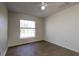Bright bedroom featuring wood floor, window and ceiling fan at 4237 Irdell Ter, North Port, FL 34288