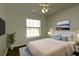 Comfortable bedroom featuring a ceiling fan, window and closet at 4237 Irdell Ter, North Port, FL 34288