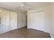 Bedroom with hardwood floors, large closet and an open entryway at 4237 Irdell Ter, North Port, FL 34288