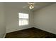 A room with hardwood floors, a window for natural light, and a ceiling fan at 4237 Irdell Ter, North Port, FL 34288