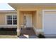 Well-maintained home featuring a covered front porch entry at 4237 Irdell Ter, North Port, FL 34288
