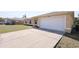 Charming home featuring a two-car garage and wide driveway at 4237 Irdell Ter, North Port, FL 34288