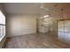 Bright living room featuring wood-look tile floors and an open concept design at 4237 Irdell Ter, North Port, FL 34288