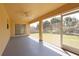 Enclosed patio with fan and plenty of sunlight at 4237 Irdell Ter, North Port, FL 34288