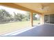 Enclosed patio featuring large grassy yard at 4237 Irdell Ter, North Port, FL 34288