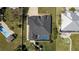 An aerial view showcasing the home's pool, screened lanai, and lush, private backyard at 4450 Northshore Dr, Punta Gorda, FL 33980