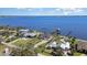 Aerial view of homes lining the waterfront with private boat docks and green lawns at 4450 Northshore Dr, Punta Gorda, FL 33980