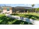 Well-manicured lawn with a pool, lanai, and lush landscaping create a private oasis at 4450 Northshore Dr, Punta Gorda, FL 33980