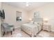 Cozy bedroom featuring neutral decor, comfortable bedding, side table and a window view at 4450 Northshore Dr, Punta Gorda, FL 33980