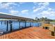 Private dock on the water featuring a boat lift and a seating area to enjoy the views at 4450 Northshore Dr, Punta Gorda, FL 33980