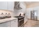 Modern kitchen featuring white cabinets, stainless steel appliances and granite countertops at 4450 Northshore Dr, Punta Gorda, FL 33980