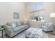 Bright living room boasts high ceilings, a large window, and comfortable seating at 4450 Northshore Dr, Punta Gorda, FL 33980