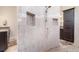 Beautiful main bathroom features a large walk-in shower with decorative tile, dual sinks and dark wood cabinets at 4450 Northshore Dr, Punta Gorda, FL 33980