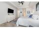Bright main bedroom boasting a ceiling fan, tray ceiling and ensuite bathroom at 4450 Northshore Dr, Punta Gorda, FL 33980