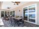 Covered patio with a dining table, chairs, an outdoor seating area, and sliding glass doors with water views at 4450 Northshore Dr, Punta Gorda, FL 33980