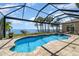 Bask in the sun by the screened pool with spa overlooking the scenic waterfront at 4450 Northshore Dr, Punta Gorda, FL 33980