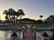 Waterfront home with a private wooden dock, lush palms, and a well-manicured lawn at 4450 Northshore Dr, Punta Gorda, FL 33980