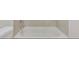 Close-up of a clean, white bathtub with modern fixtures and a tiled surround at 4517 Meager Cir, Port Charlotte, FL 33948
