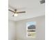 Neutral bedroom features a ceiling fan and bright window views at 4517 Meager Cir, Port Charlotte, FL 33948