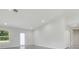Bright open living space with vaulted ceilings, and tile flooring at 4517 Meager Cir, Port Charlotte, FL 33948