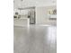 Living area showcasing open-concept design connecting to the kitchen and backyard at 4517 Meager Cir, Port Charlotte, FL 33948