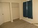 Spare bedroom with a window, closet, and wood-look flooring at 503 Myrtle St, Punta Gorda, FL 33950