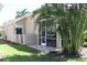 A serene outdoor space features a screened lanai, brick patio, and lush landscaping, perfect for relaxation at 629 Misty Pine Dr, Venice, FL 34292