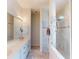 The bathroom features marble counters and a glass shower enclosure at 629 Misty Pine Dr, Venice, FL 34292