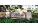 Elegant community sign for Sawgrass, surrounded by lush landscaping, creating a welcoming entrance at 629 Misty Pine Dr, Venice, FL 34292