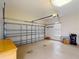 This is a large garage with a door that's been painted white and lots of space at 629 Misty Pine Dr, Venice, FL 34292