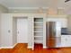 Well-organized kitchen featuring stainless steel refrigerator and a pantry for ample storage and convenience at 629 Misty Pine Dr, Venice, FL 34292