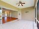 The outdoor lanai with tile floors features views into the living area of the home at 629 Misty Pine Dr, Venice, FL 34292