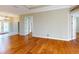Inviting living room with hardwood floors offering seamless transitions to the entry and other rooms at 629 Misty Pine Dr, Venice, FL 34292