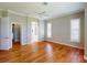 Main bedroom boasts wood floors and easy access to the bathroom and closet at 629 Misty Pine Dr, Venice, FL 34292