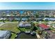 Aerial view showcasing home's waterfront location, private dock, and community canal system at 740 Via Esplanade, Punta Gorda, FL 33950