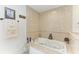 Luxurious bathroom features a large soaking tub with tiled surround and elegant fixtures at 740 Via Esplanade, Punta Gorda, FL 33950