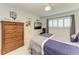 Bedroom featuring neutral walls, plantation shutters and tile flooring at 740 Via Esplanade, Punta Gorda, FL 33950