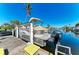 Close up of a covered boat on a lift at the private dock at 740 Via Esplanade, Punta Gorda, FL 33950