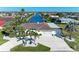 Beautiful home with a tile roof, tropical landscaping, and a wide driveway leading to an attached two-car garage at 740 Via Esplanade, Punta Gorda, FL 33950