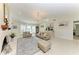 Spacious living area with fireplace, chandelier, and neutral decor at 740 Via Esplanade, Punta Gorda, FL 33950