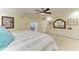Serene main bedroom with tiled floors, plentiful dresser storage, and private outdoor access at 740 Via Esplanade, Punta Gorda, FL 33950