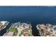 Wide aerial view of property close to bay with waterfront access and multiple docks at 8 Ocean Dr, Punta Gorda, FL 33950