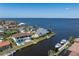 Aerial view of property and neighboring waterfront homes on a clear day at 8 Ocean Dr, Punta Gorda, FL 33950
