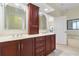 Bathroom featuring a double vanity, mirror, and drawers at 8 Ocean Dr, Punta Gorda, FL 33950