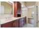 Bathroom featuring a double sink vanity and hardwood floors at 8 Ocean Dr, Punta Gorda, FL 33950